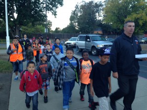 Principal Tom Lindeman leads a walking school bus at Thomas Edison Language Institute.